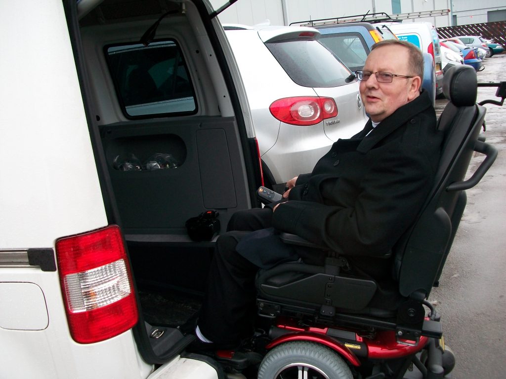 Picture of Mr white entering a Sirus Automotive wheelchair accessible vehicle