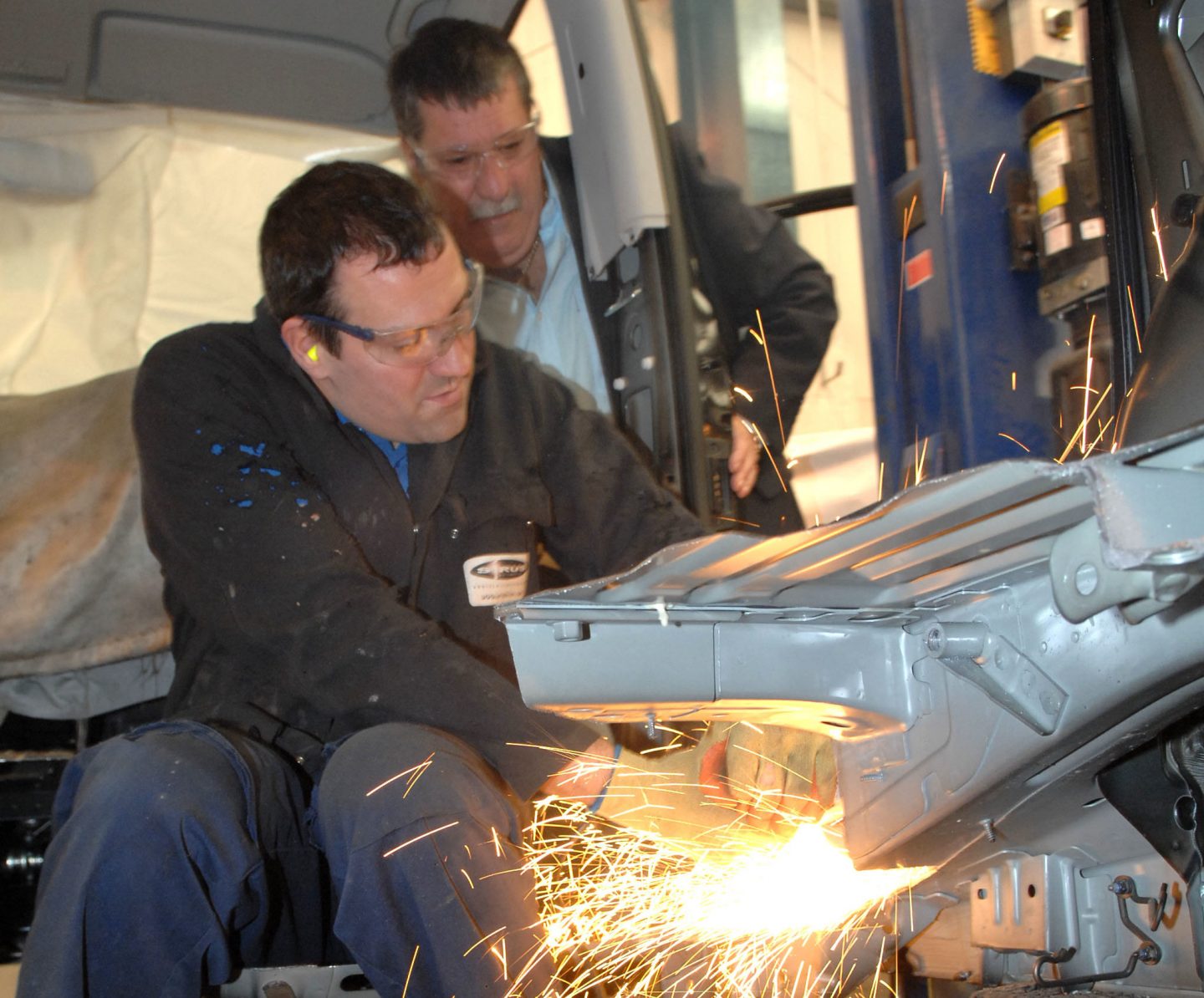 Sirus employee welding vehicle door in west midlands