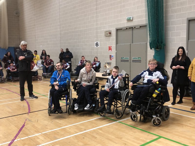 Group photo at a powerchair football match in west midlands
